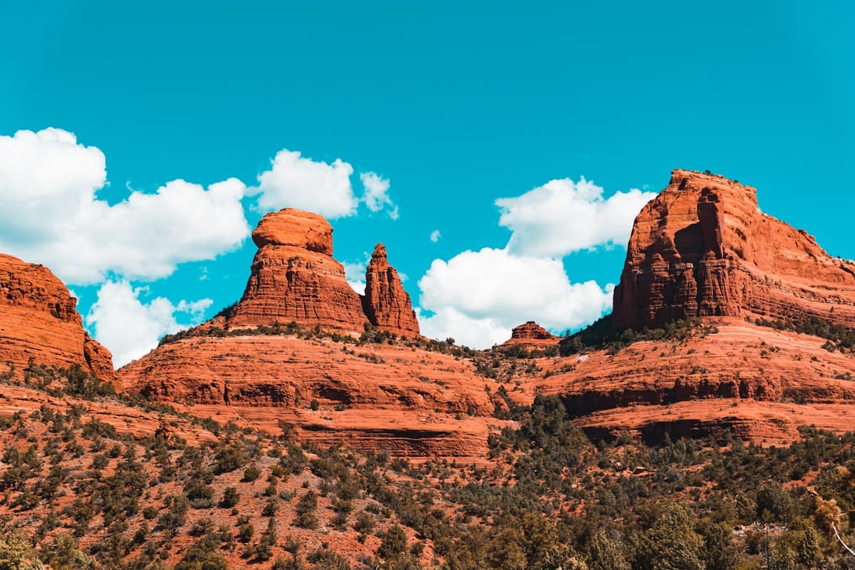 Sedona's red rock canyon under a wide blue sky