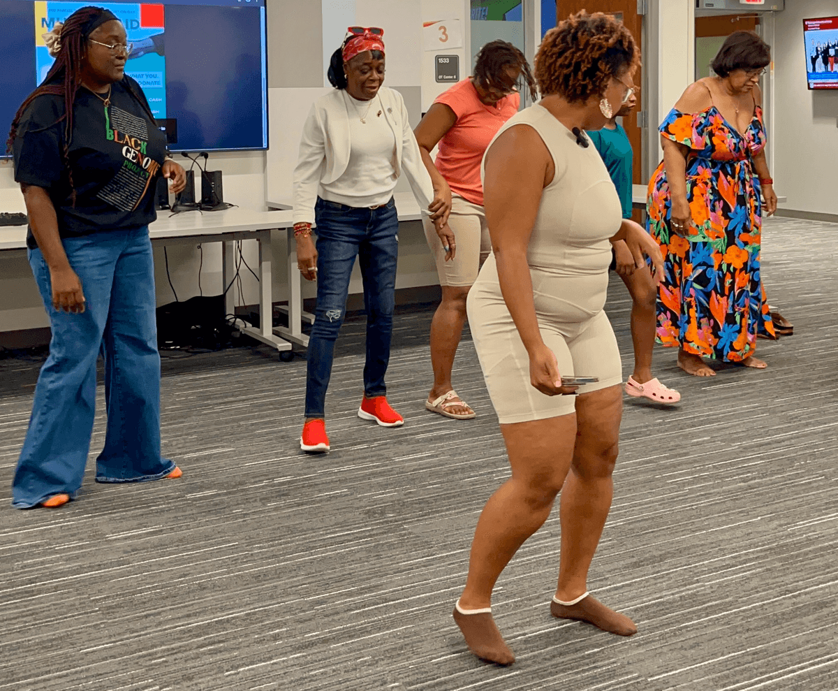 Participants practicing together at a community session