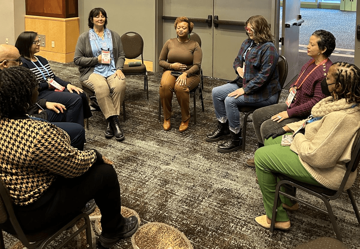 Woods leading a community wellness session